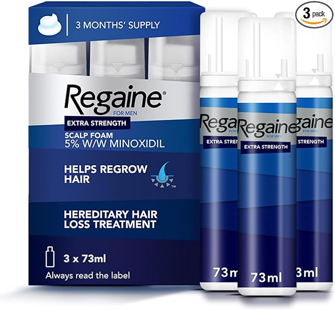 Three-pack of Regaine for Men Extra Strength Scalp Foam, each canister 73ml, with packaging indicating 5% w/w minoxidil and designed for hereditary hair loss treatment
